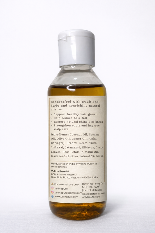 Bottle of herbal oil with a label on a white background